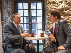 Prime Minister Justin Trudeau and Quebec Premier François Legault chat over coffee in Montreal on Dec. 20, 2022. Legault and the rest of Canada's premiers will meet with Trudeau for a negotiating session on health-care financing on Feb. 7.