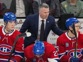 Montreal Canadiens head coach Martin St. Louis behind the bench during game against the Nashville Predators in Montreal on Jan. 12, 2023.
