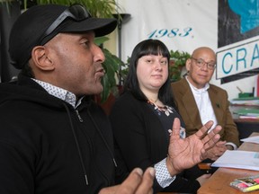 Fo Niemi, right, Executive Director of CRARR, listens as Stéphane Thalès, IRERR Assistant Project Coordinator, and Kathleen Barera, CRARR Complaints Officer, on Wednesday, February 1, 2023, at the CRARR offices in Montreal on the research related to the Racial speak profiling.