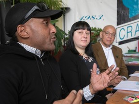 Fo Niemi, right, executive director of CRARR, listens to IRERR deputy project co-ordinator Stéphane Thalès and CRARR complaints officer Kathleen Barera speak about research on racial profiling at the CRARR offices in Montreal on Wednesday, Feb. 1, 2023.
