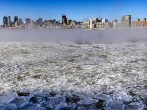 Ice and vapour partially obscure the view of Montreal's skyline on a bitterly cold and windy day Feb. 3, 2023.