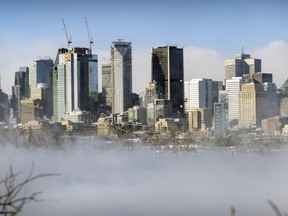 Vapour rising off the water partially obscures the skyline on a bitterly cold and windy day in Montreal on Friday, Feb. 3, 2023.