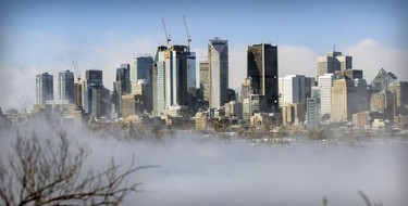 Vapour rising off the water partially obscures the skyline on a bitterly cold and windy day in Montreal on Friday, Feb. 3, 2023.