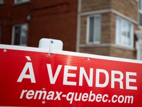 A for sale sign on a residential property in Montreal is seen in this file photo.