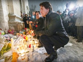 Prime Minister Justin Trudeau attends a vigil outside Église Ste-Rose-de-Lima in Laval, north of Montreal Thursday Feb. 9, 2023 in memory of the children killed when a city bus was driven into a daycare the day before.