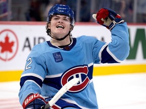 Montreal Canadiens right-winger Cole Caufield celebrates after scoring to tie the game against the Anaheim Ducks in Montreal on Dec. 15, 2022.
