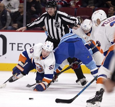 New York Islanders centre Casey Cizikas (53) hits the surface after a puck drop during first-period action against the New York Islanders in Montreal, on Saturday, Feb. 11, 2023.