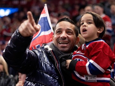 Young hockey fans enjoy a matinee game during NHL play between the Canadiens and the Edmonton Oilers in Montreal on Sunday, Feb. 12, 2023.