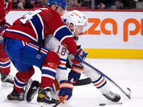 Montreal Canadiens defenceman Jordan Harris drags down Edmonton Oilers left-wing Zach Hyman during second period in Montreal on Feb. 12, 2023.