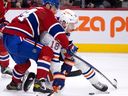 Montreal Canadiens defenceman Jordan Harris drags down Edmonton Oilers left-wing Zach Hyman during second period in Montreal on Feb. 12, 2023. 
