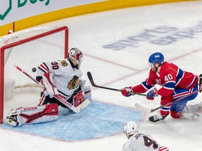 Montreal Canadiens right wing Joel Armia (40) scores on Chicago Blackhawks goaltender Jaxson Stauber (30) during 3rd period NHL action at the Bell Centre in Montreal on Tuesday Feb. 14, 2023.