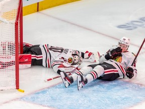 Chicago Blackhawks goaltender Jaxson Stauber (30) lays flat on the ice after being scored on by Montreal Canadiens right wing Joel Armia (40) during 3rd period NHL action at the Bell Centre in Montreal on Tuesday Feb. 14, 2023.