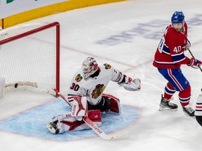 Montreal Canadiens defenceman Justin Barron (unseen) scores against Chicago Blackhawks goaltender Jaxson Stauber (30) during 1st period NHL action at the Bell Centre in Montreal on Tuesday Feb. 14, 2023.