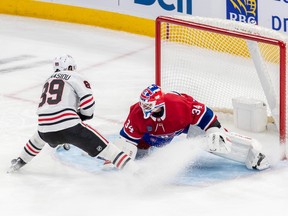Chicago Blackhawks center Andreas Athanasiou (89) is stopped by Montreal Canadiens goaltender Jake Allen (34) on a breakaway during 1st period NHL action at the Bell Centre in Montreal on Tuesday Feb. 14, 2023.