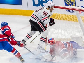 Chicago Blackhawks center Andreas Athanasiou (89) crashes into Montreal Canadiens goaltender Jake Allen (34) net but the goal did not count during 1st period NHL action at the Bell Centre in Montreal on Tuesday Feb. 14, 2023.