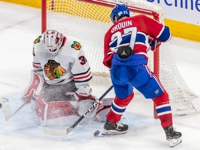 Montreal Canadiens left wing Jonathan Drouin is stopped by Chicago Blackhawks' Jaxson Stauber during second period at the Bell Centre in Montreal on Feb. 14, 2023.