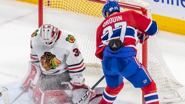Montreal Canadiens left wing Jonathan Drouin is stopped by Chicago Blackhawks' Jaxson Stauber during second period at the Bell Centre in Montreal on Feb. 14, 2023.