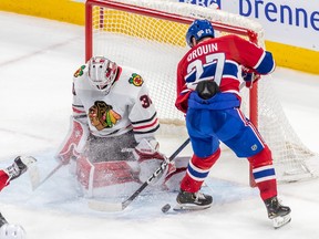 Montreal Canadiens left wing Jonathan Drouin (27) was stopped in front of the net by Chicago Blackhawks goaltender Jaxson Stauber (30)) during 2nd period NHL action at the Bell Centre in Montreal on Tuesday Feb. 14, 2023.
