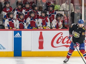 A Ukrainian Peewee team watch Montreal Canadiens right wing Evgenii Dadonov (63) during the warmup prior to the Montreal Canadiens Chicago Blackhawks NHL game at the Bell Centre in Montreal on Tuesday Feb. 14, 2023.