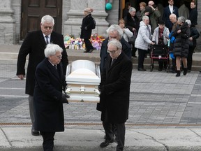 The casket of Jacob Gauthier is carried following funeral at Sainte-Rose de Lima church in Laval on Thursday, Feb. 16, 2023.