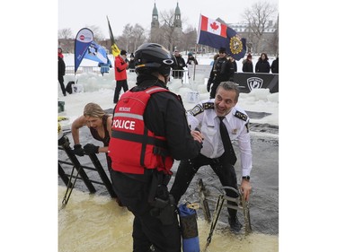 Fady Dagher, directeur du Service de police de la Ville de Montréal (SPVM) emerges from the Lachine Canal on Saturday, Feb. 18, 2023, for the 15th edition of the Polar Bear Challenge.