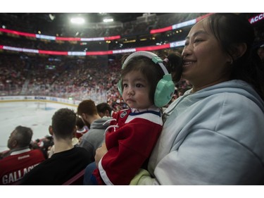 Linda Tan and daughter Amy-Lee Tan-Bergeron enjoy the Canadiens skills competition at the Bell Centre in Montreal on Sunday, Feb. 19, 2023.