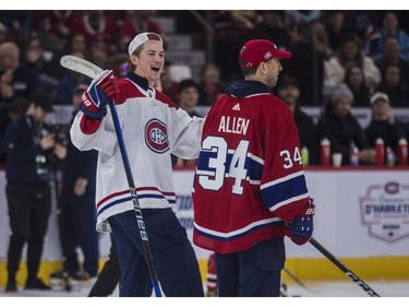 Montreal Canadiens goalie Sam Montembeault is impressed with shooting skills of his net-minding partner Jake Allen at the Canadiens team skills competition at the Bell Centre in Montreal on Sunday, Feb. 19, 2023.
