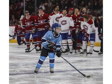 Brysen Byron, son of Canadiens' Paul Byron, heads to the net in a shootout competition at the Canadiens skills competition at the Bell Centre in Montreal on Sunday, Feb. 19, 2023.