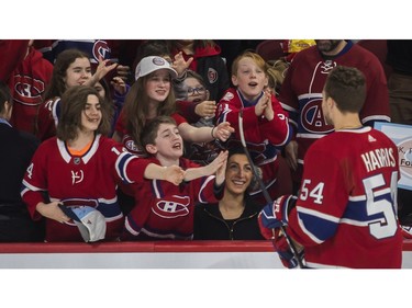 Young fans badly want what Jordan Harris may be giving at the Canadiens skills competition at the Bell Centre in Montreal on Sunday, Feb. 19, 2023.