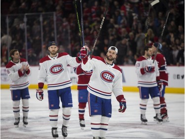 Jonathan Drouin and Canadiens teammates salute fans at the Canadiens skills competition at the Bell Centre in Montreal on Sunday, Feb. 19, 2023.