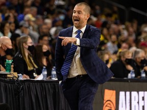 Ottawa Blackjacks head coach Charles Dubé-Brais speaks to his players during first half of CEBL semifinal against the Edmonton Stingers in Edmonton on Aug. 20, 2021.