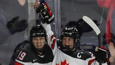 Marie-Philip Poulin (right) celebrates her goal on team USA, with teammate Brianne Jenner during second period action in the final game of the women's hockey Rivalry Series in Laval on Wednesday Feb. 22, 2023.