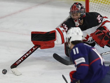 Team Canada's Ann-Renée Desbiens shoots away a rebound during third period action against team USA, in the final game of the women's hockey Rivalry Series in Laval on Wednesday Feb. 22, 2023.