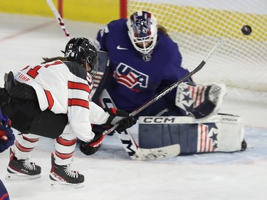 Team Canada's Victoria Bach scores on team USA's Maddie Rooney during second period action in the final game of the women's hockey Rivalry Series in Laval on Wednesday Feb. 22, 2023.