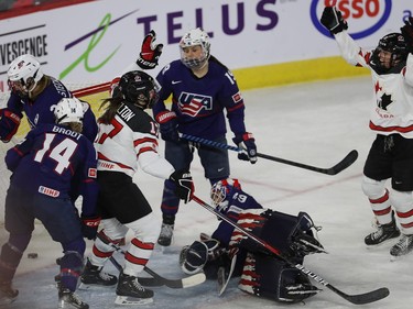 Ella Shelton (17) from Team Canada celebrates goal with teammate Emily Clark (right) after scoring on team USA Nicole Hensley, during first period action in the final game of the women's hockey Rivalry Series in Laval on Wednesday Feb. 22, 2023.