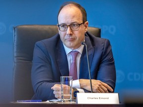 Caisse de dépot CEO Charles Emond listens to a question at press conference revealing the Caisse's annual results at their headquarters in Montreal on Thursday, Feb. 23, 2023.