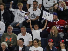 Fans of the Laval Rocket cheer on their team at Place Bell in Laval on May 22, 2022.