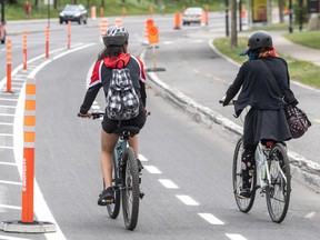 Cyclists head south on Christophe-Colomb Ave. in Montreal on June 1, 2020.