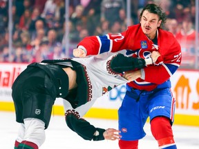 Montreal Canadiens’ Arber Xhekaj punches Arizona Coyotes Zack Kassian during first period in Montreal on Oct. 20, 2022.