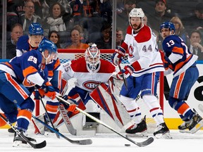 Sam Montembeault of the Montreal Canadiens defends the net against the New York Islanders during the first period at the UBS Arena in Elmont, N.Y., on Jan. 14, 2023.