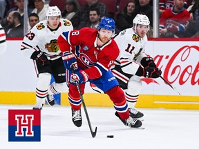 Mike Matheson plays the puck against the Chicago Blackhawks during the first period at Bell Centre on Feb. 14, 2023.