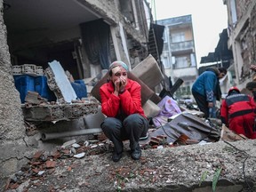 An earthquake survivor in Turkey the day after a 7.8-magnitude earthquake struck the country's southeast Feb. 7, 2023. Rescuers in Turkey and Syria braved frigid weather, aftershocks and collapsing buildings as they dug for survivors.