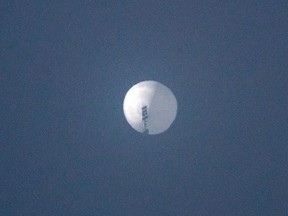 In this photo taken on Feb. 1, 2023, this handout photo from Chase Doak released on Feb. 2 shows a suspected Chinese spy balloon in the sky over Billings, Montana.
