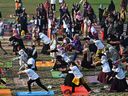 People take part in a yoga training session at a university in Lahore, Pakistan on Feb. 26, 2023.