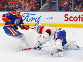 Oilers forward Connor McDavid (97) scores a goal against Canadiens goaltender Jake Allen during the third period at Rogers Place on Dec. 3, 2022, in Edmonton.