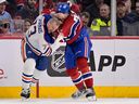 Montreal Canadiens defenceman Arber Xhekaj fights with Edmonton Oilers blue-liner Vincent Desharnais during the second period at the Bell Centre in Montreal on Feb. 12, 2023.