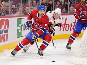 Canadiens defenceman Mike Matheson (8) plays the puck and Ottawa Senators forward Brady Tkachuk (7) forechecks during the first period at the Bell Centre in Montreal on Saturday, Feb. 25, 2023.