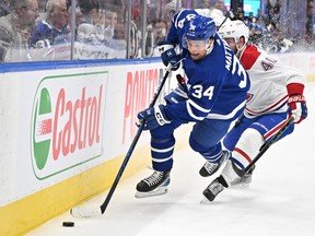 Maple Leafs forward Auston Matthews (34) pursues the puck ahead of Montreal Canadiens forward Joel Armia (40) in the first period at Scotiabank Arena in Toronto on Saturday, Feb. 18, 2023.