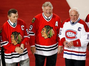 Stan Mikita, from left, Bobby Hull and Henri Richard stand at centre ice as former greats of the Chicago Blackhawks were honoured by the Montreal Canadiens on Jan. 8, 2008, at the Bell Centre in Montreal prior to the game between the Canadiens and Blackhawks.