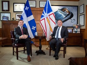 Newfoundland and Labrador Premier Andrew Furey and Quebec Premier Francois Legault  pose in the Office of the Premier at the Confederation Building in St. John's on Friday, February 24, 2023.